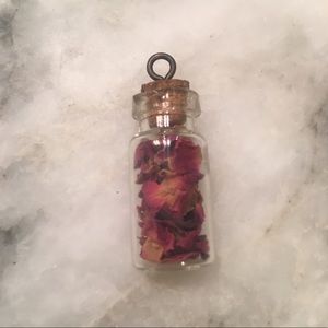 Bottle of rose petals necklace